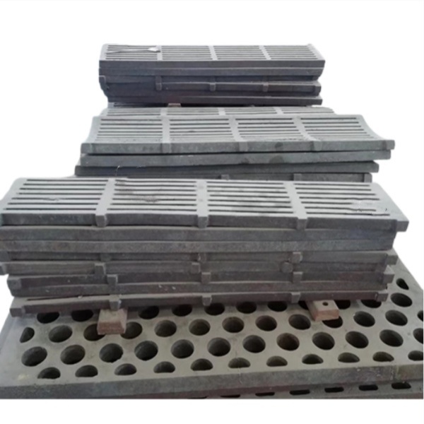 Crusher grate plate assortment with slotted and perforated patterns - manganese steel casting for jaw crusher and hammer mill output sizing - ZHILI foundry
