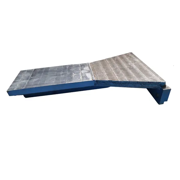 Roller press side baffle cheek plate with segmented wear surface and blue painted steel frame - alloy steel casting for HPGR material containment and edge protection - ZHILI foundry