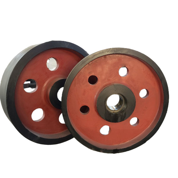 Crusher flywheel pulley pair with red cast iron body, black rim and lightweighting holes - jaw crusher inertia wheel for energy storage - ZHILI foundry