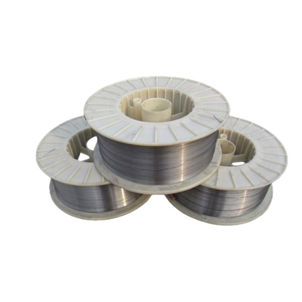 Hardfacing flux-cored welding wire spools in three large plastic reels - shiny metallic coiled wire for wear resistant surfacing and overlay welding on crusher and mill components - ZHILI foundry