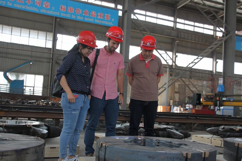 Spanish visitors inspecting large hardfaced casting parts at ZHILI factory