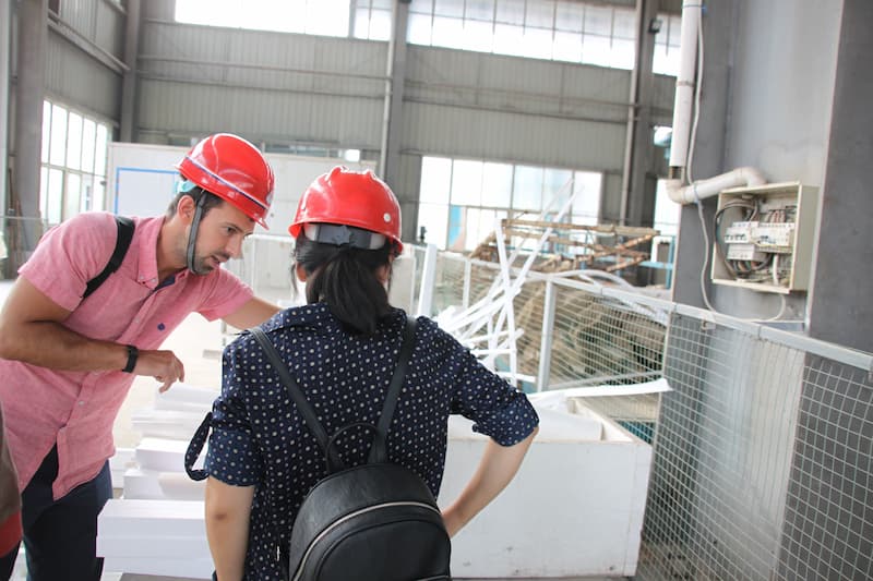 Spanish customers talking with ZHILI engineers about hardfacing technology