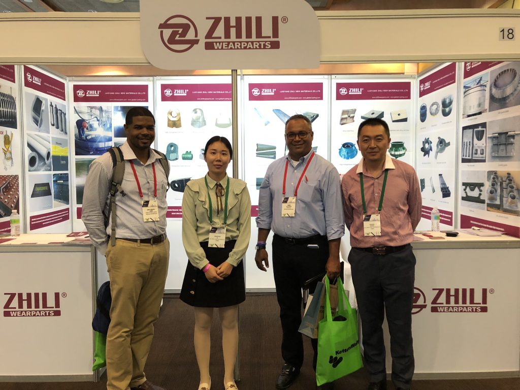 Buyers take group photo with ZHILI team at Dominican Republic Mining Exhibition after viewing crusher wear parts