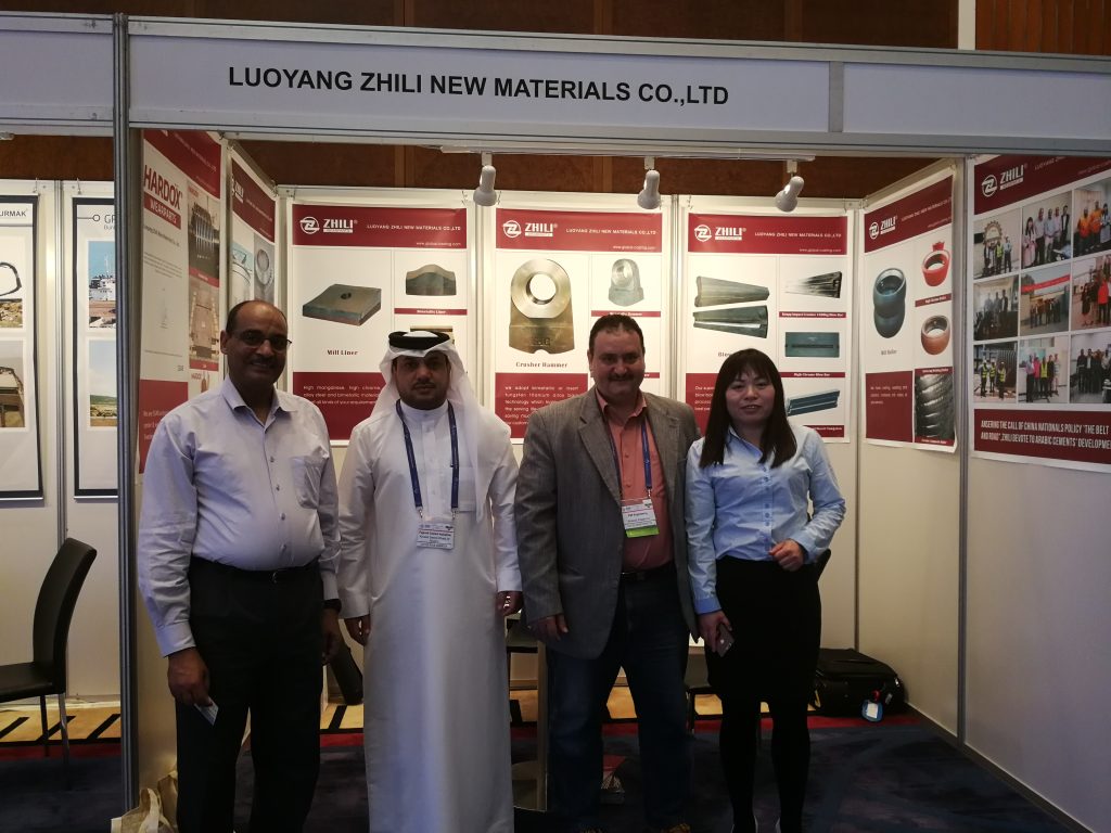 Buyers take group photo with ZHILI team at Dubai Mining Exhibition after viewing roller press wear parts