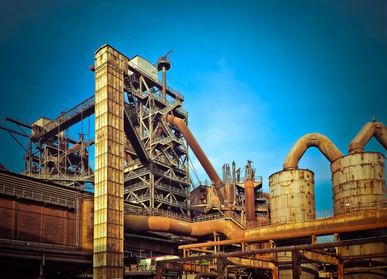 Steel plant with continuous casting machine and ladle handling equipment — showcasing ZHILI heat-resistant castings for ladle shrouds, tundish nozzles, and slag runners in steelmaking operations